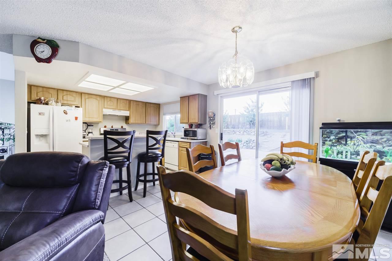 4275 Perro Lane Reno, NV 89502 - Photo 15 of 32 a view of a dining room with furniture window and outside view