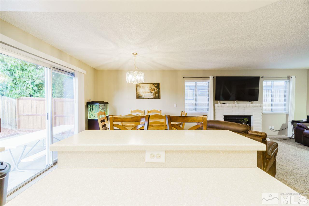 4275 Perro Lane Reno, NV 89502 - Photo 17 of 32 a spacious bedroom with a large bed and a flat screen tv