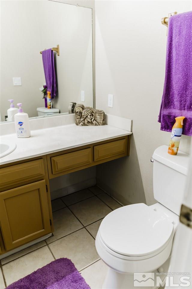 4275 Perro Lane Reno, NV 89502 - Photo 19 of 32 a bathroom with a sink and a mirror