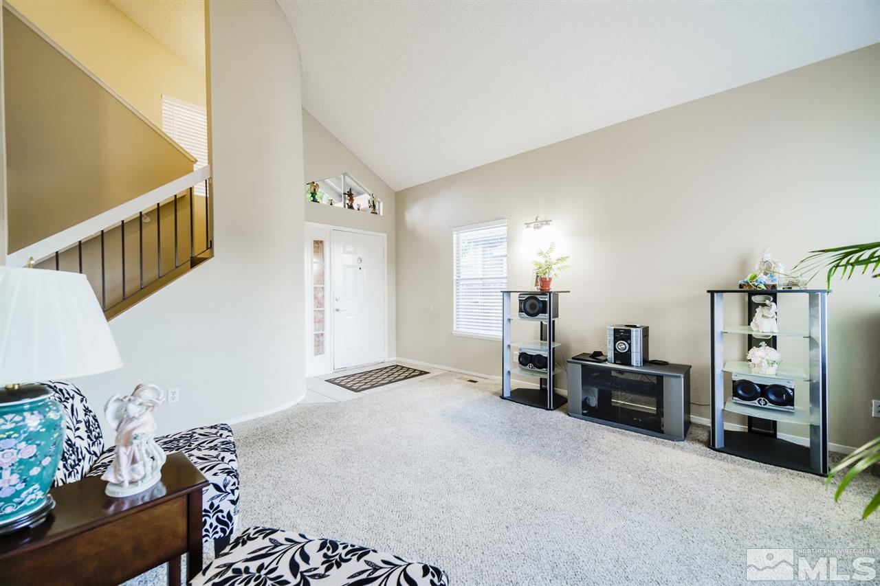 4275 Perro Lane Reno, NV 89502 - Photo 2 of 32 a view of a livingroom with furniture and an empty room