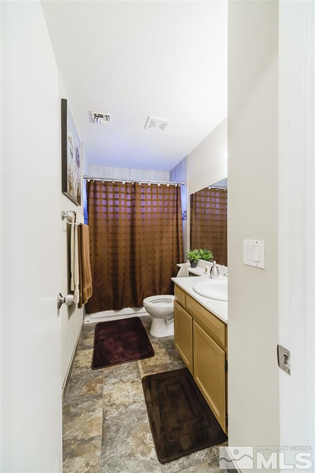 4275 Perro Lane Reno, NV 89502 - Photo 21 of 32 a bathroom with a sink a toilet and shower