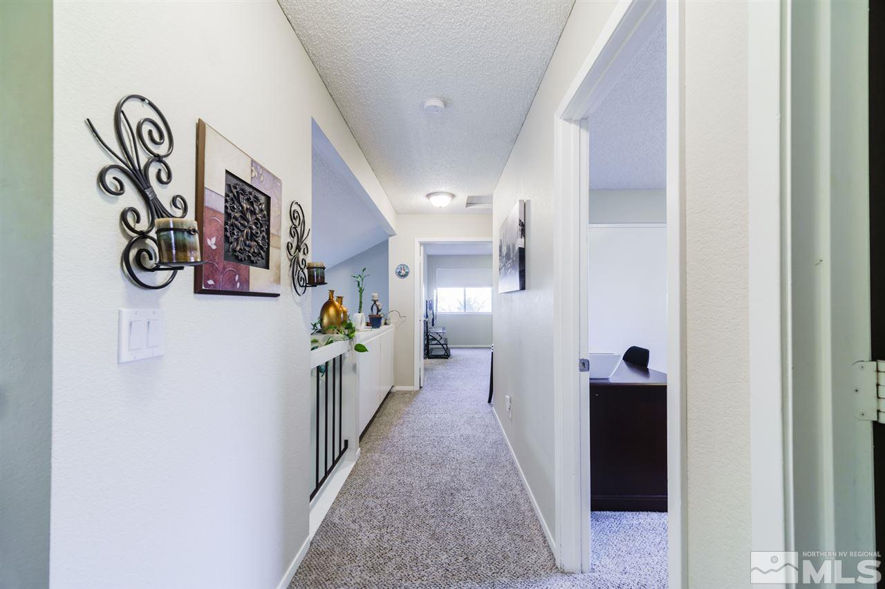 4275 Perro Lane Reno, NV 89502 - Photo 23 of 32 a hallway with a storage and utility room