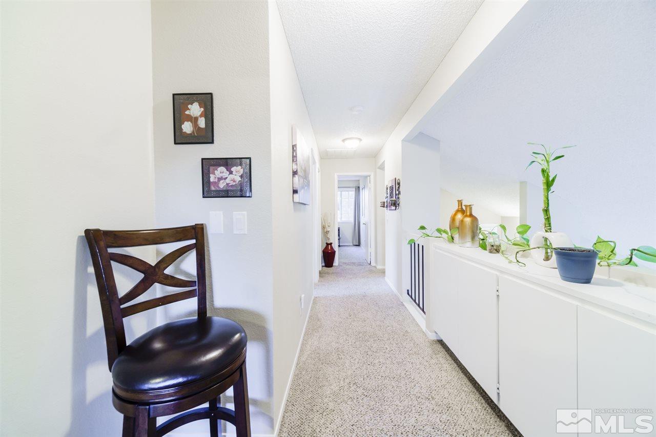 4275 Perro Lane Reno, NV 89502 - Photo 28 of 32 a view of a hallway to a livingroom and a couch