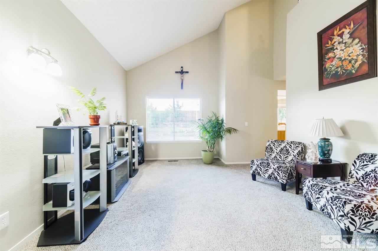 4275 Perro Lane Reno, NV 89502 - Photo 4 of 32 a bed room with furniture and a book shelf