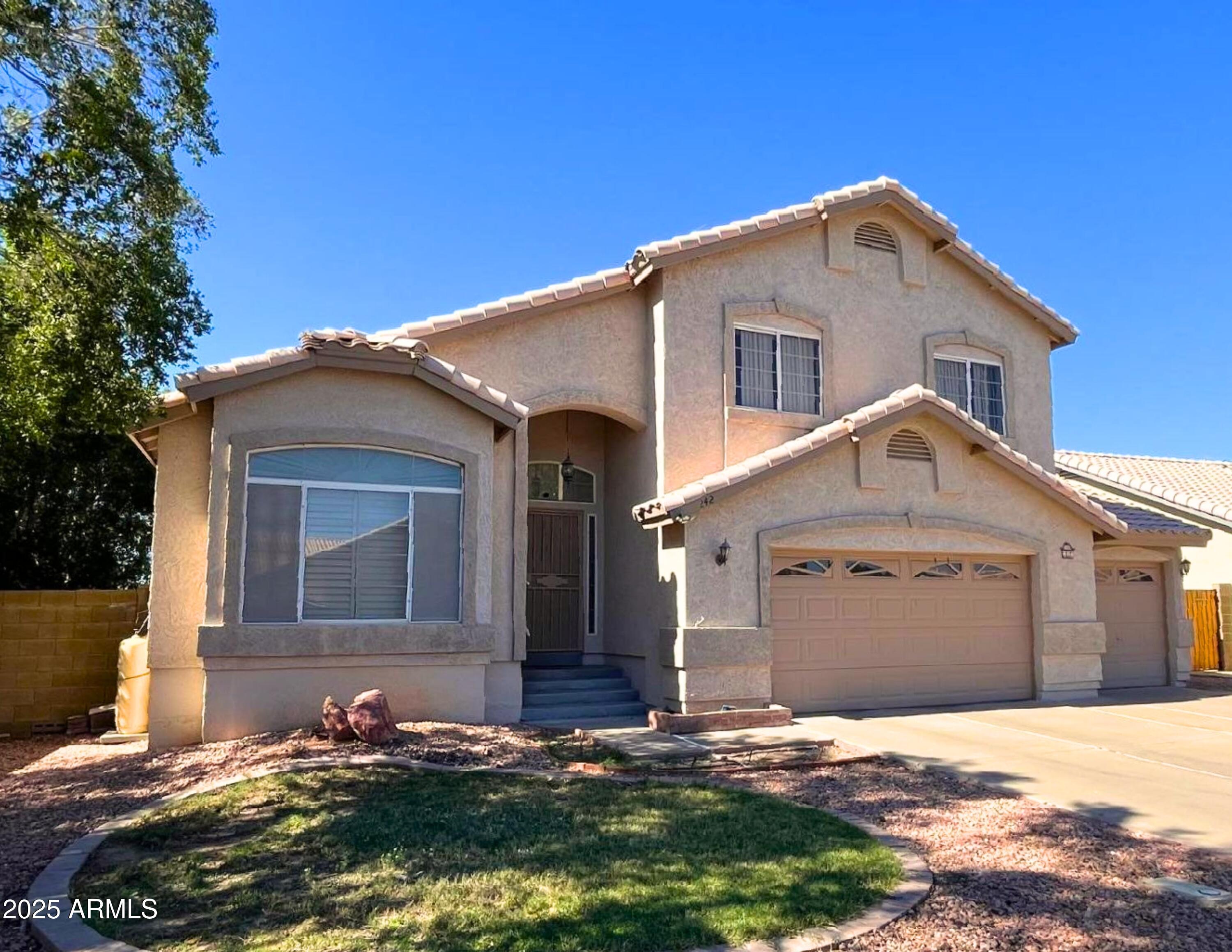 242 South Sycamore Place Chandler, AZ 85224 - Photo 1 of 40 a front view of a house with a yard