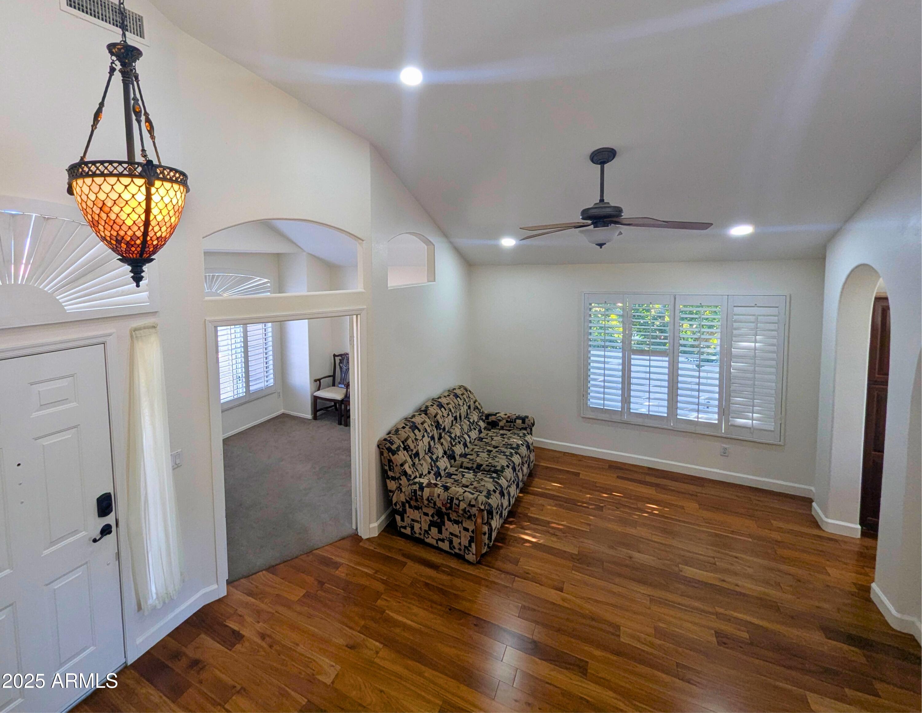 242 South Sycamore Place Chandler, AZ 85224 - Photo 10 of 40 a view of a livingroom with furniture and wooden floor