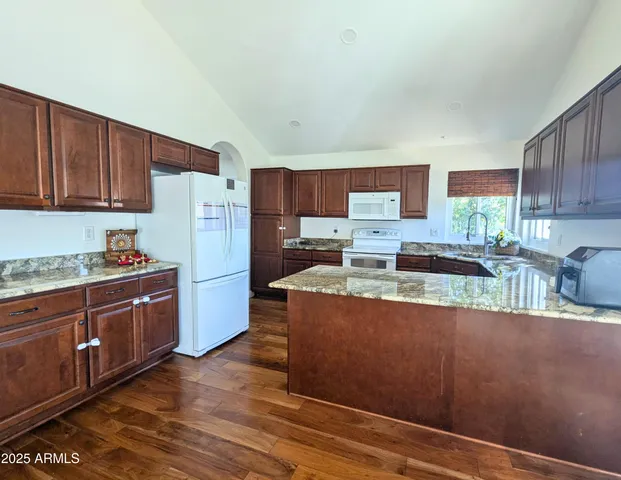 a room with furniture and wooden floor