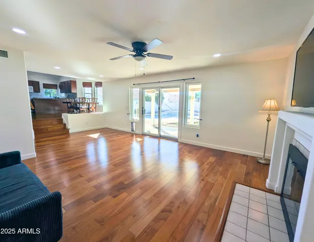 a kitchen with a table chairs refrigerator and cabinets