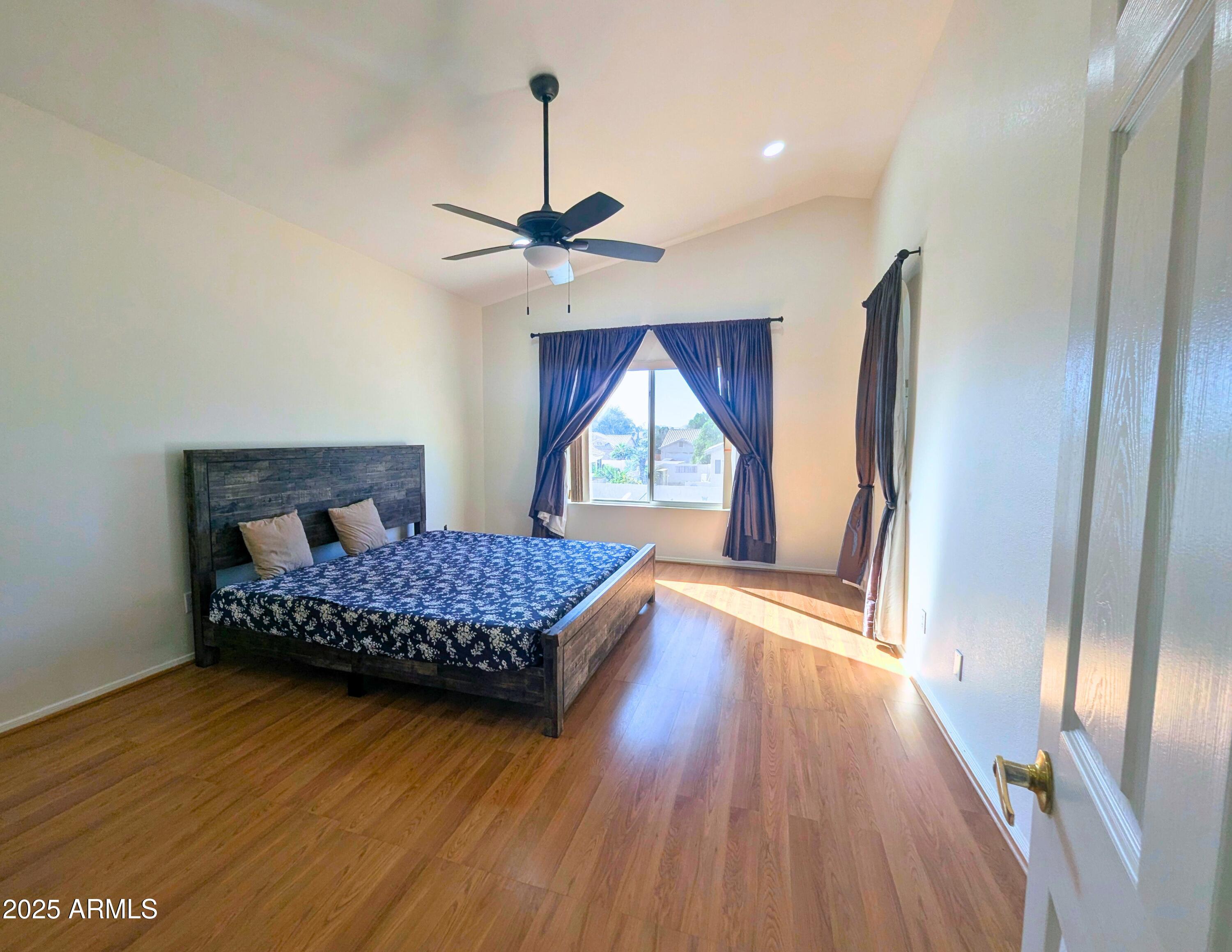 242 South Sycamore Place Chandler, AZ 85224 - Photo 21 of 40 a bedroom with a bed and a window