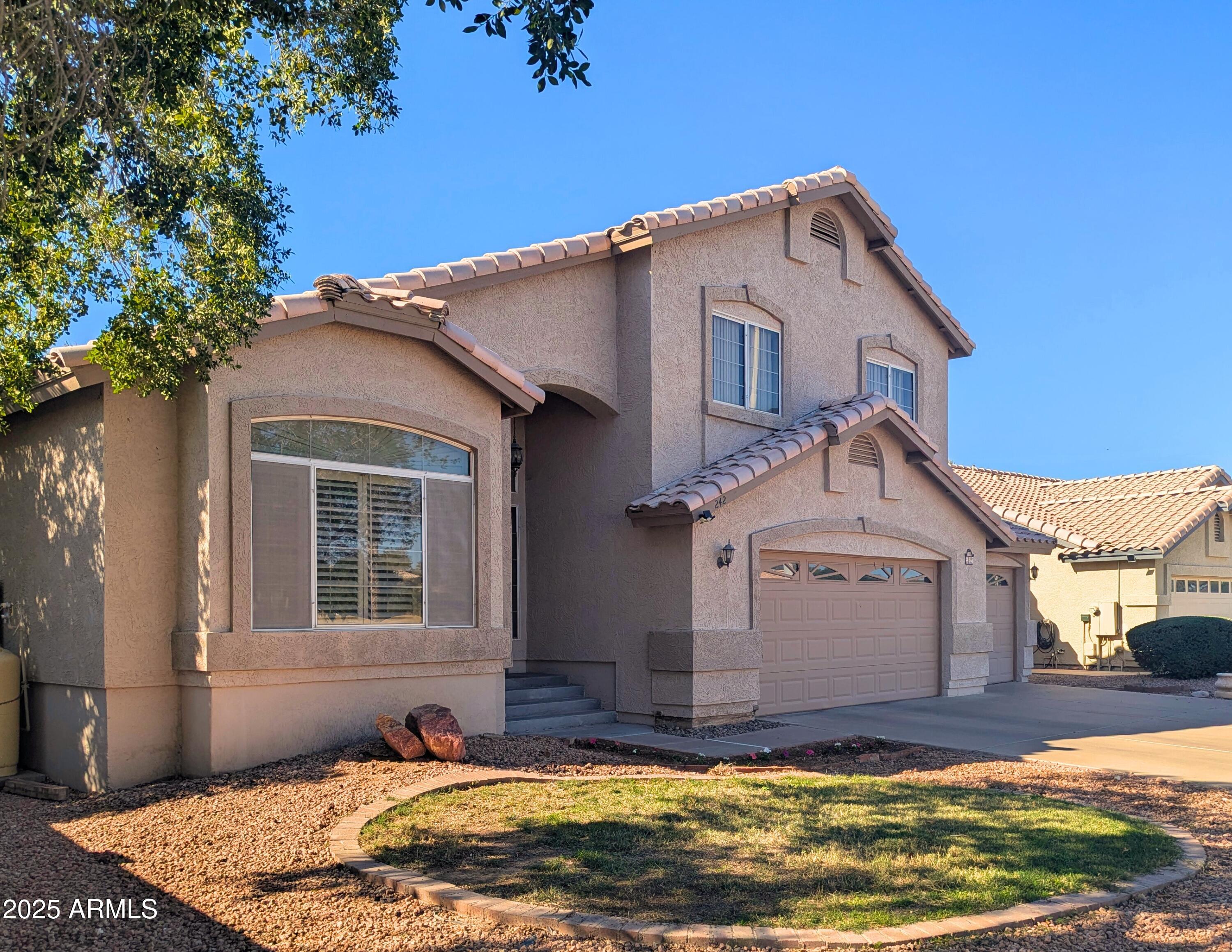 242 South Sycamore Place Chandler, AZ 85224 - Photo 2 of 40 a view of a house with a swimming pool