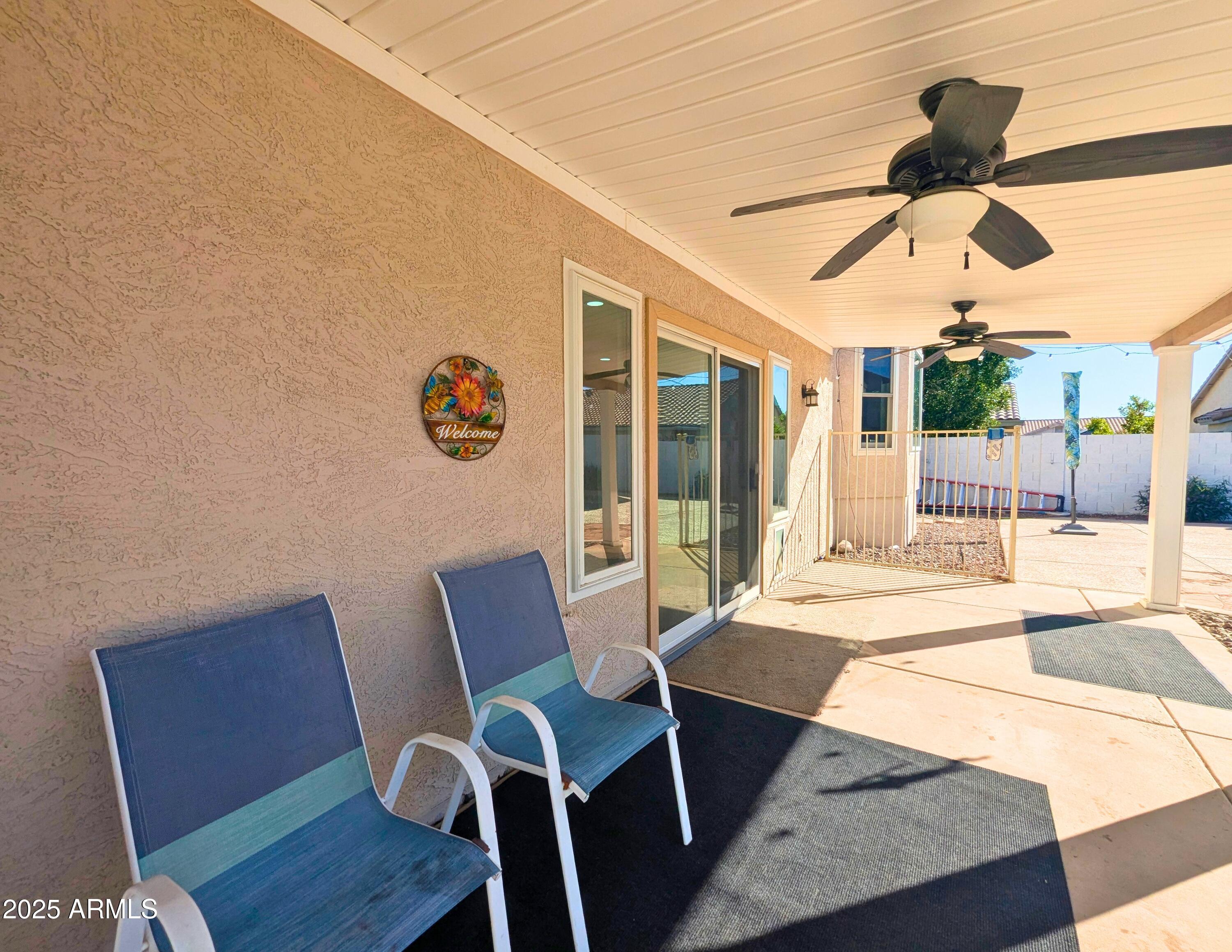 242 South Sycamore Place Chandler, AZ 85224 - Photo 30 of 40 a view of a dining room with furniture wooden floor and chandelier