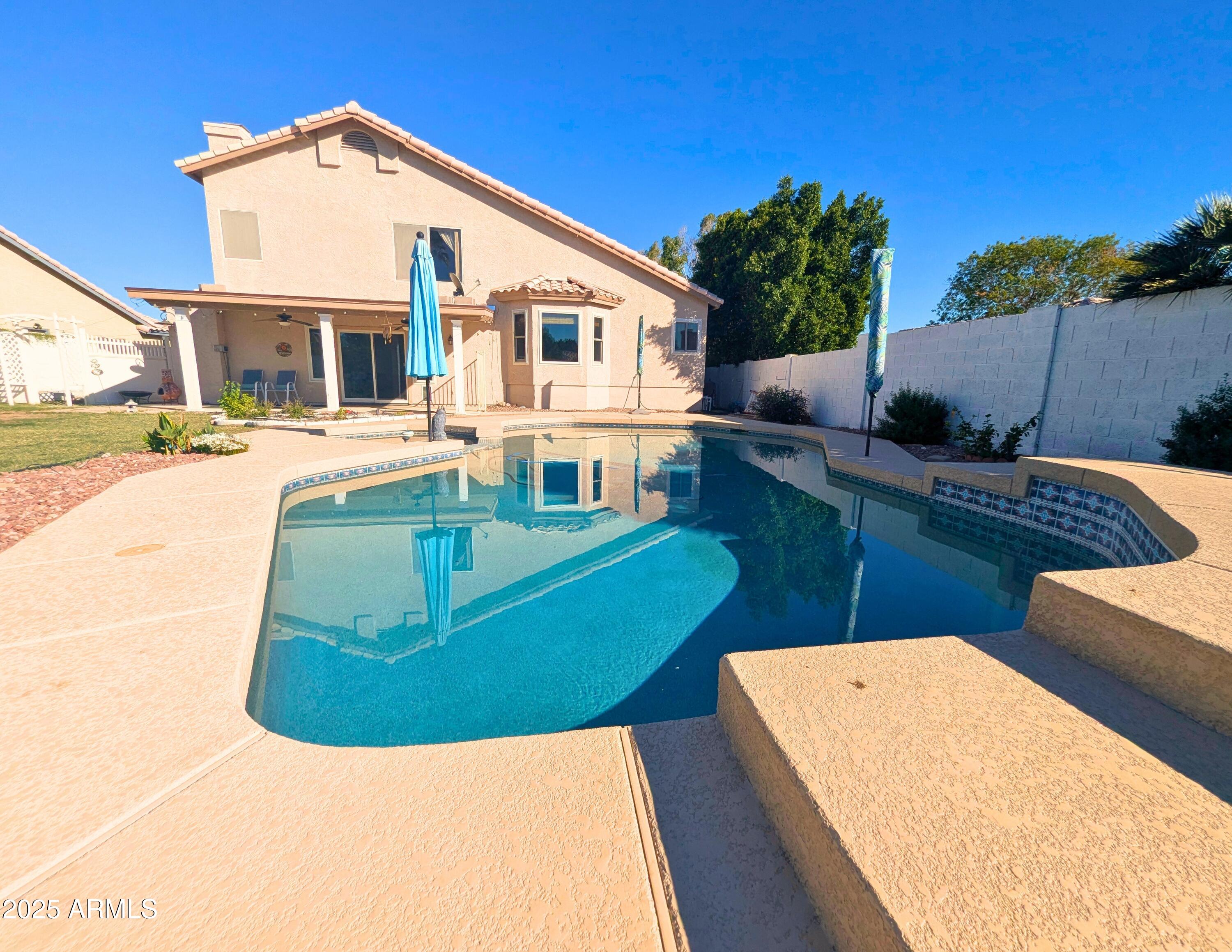 242 South Sycamore Place Chandler, AZ 85224 - Photo 34 of 40 a view of a house with pool