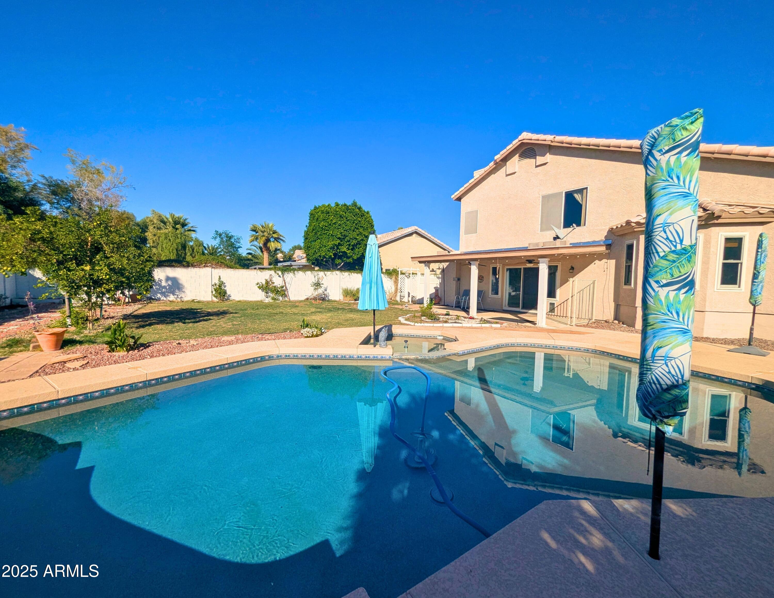 242 South Sycamore Place Chandler, AZ 85224 - Photo 36 of 40 a view of a house with pool and chairs