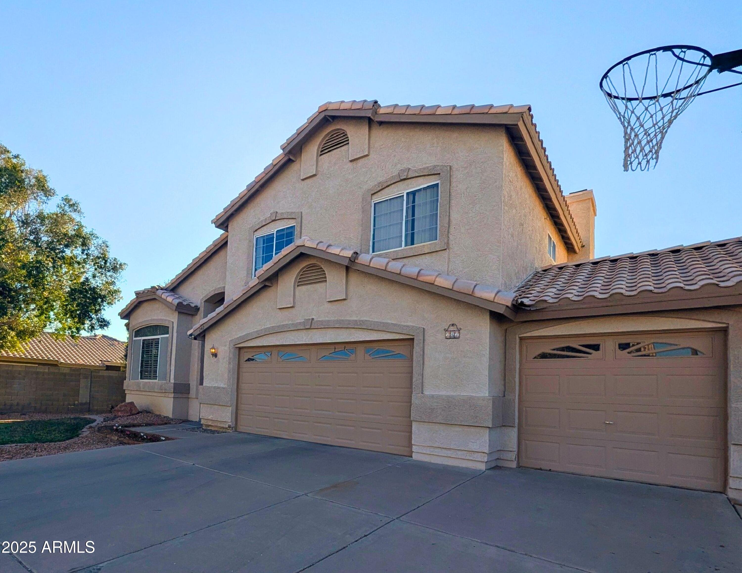 242 South Sycamore Place Chandler, AZ 85224 - Photo 3 of 40 a front view of a house with garage