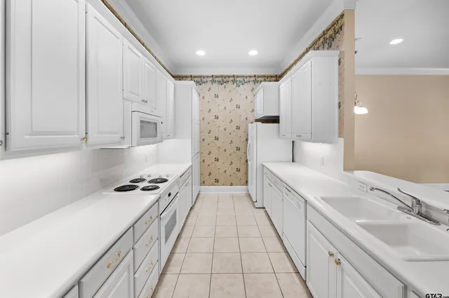 a spacious bathroom with a double vanity sink a mirror and a shower