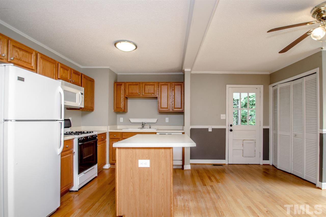 736 Mial Street Raleigh, NC 27608 - Photo 13 of 23 a kitchen with a sink stove and refrigerator