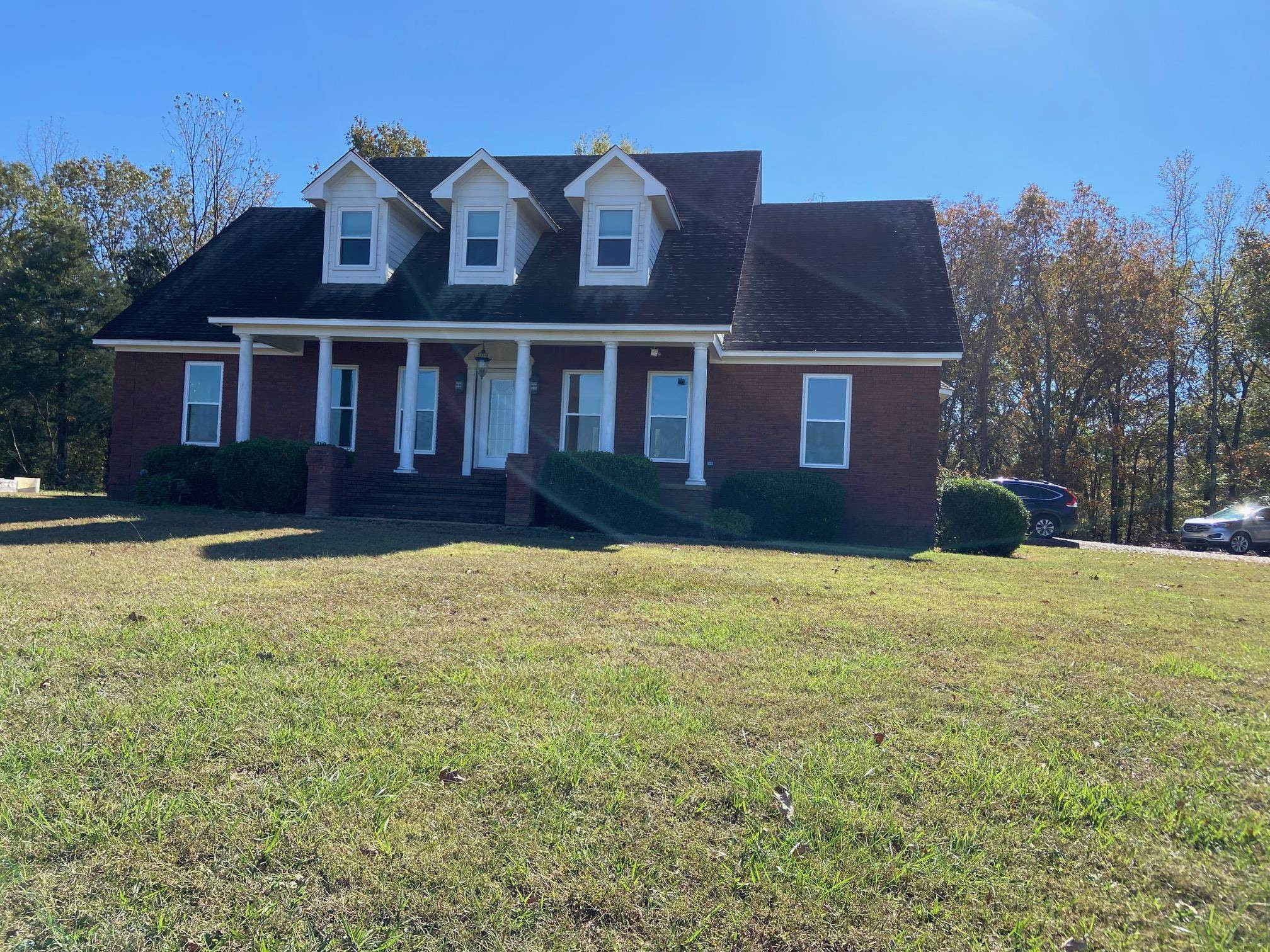 3650 Talley Store Road Henderson, TN 38340 - Photo 2 of 42 a front view of a house with a yard