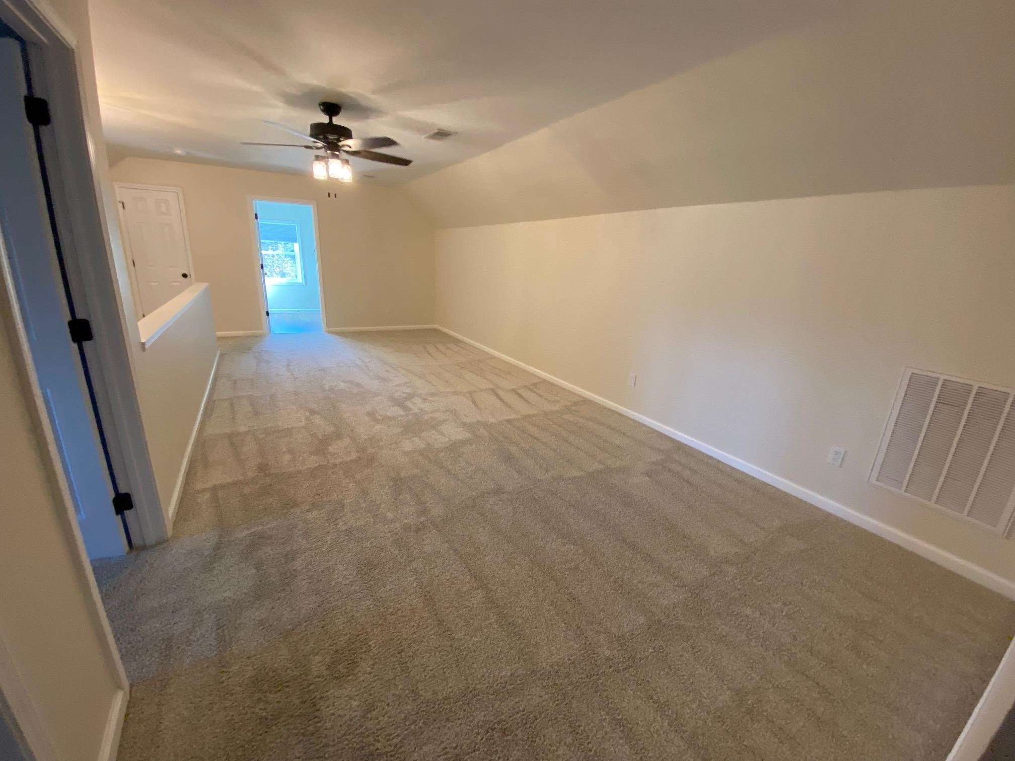 3650 Talley Store Road Henderson, TN 38340 - Photo 25 of 42 en empty room with wooden floor and fan