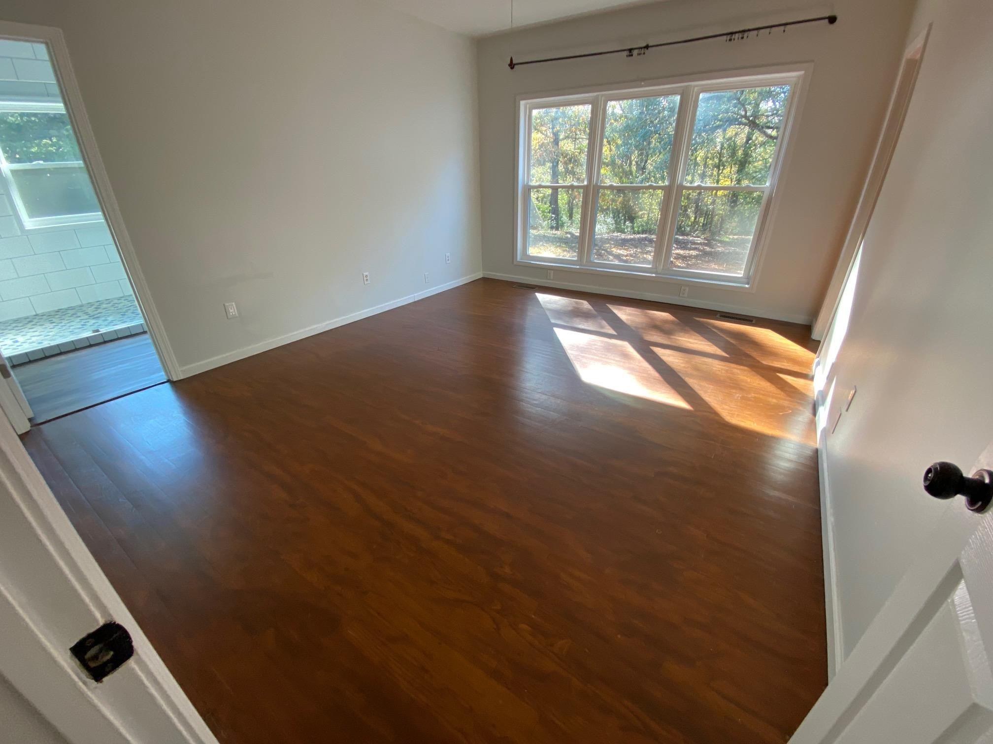 3650 Talley Store Road Henderson, TN 38340 - Photo 28 of 42 a view of an empty room with wooden floor and a window