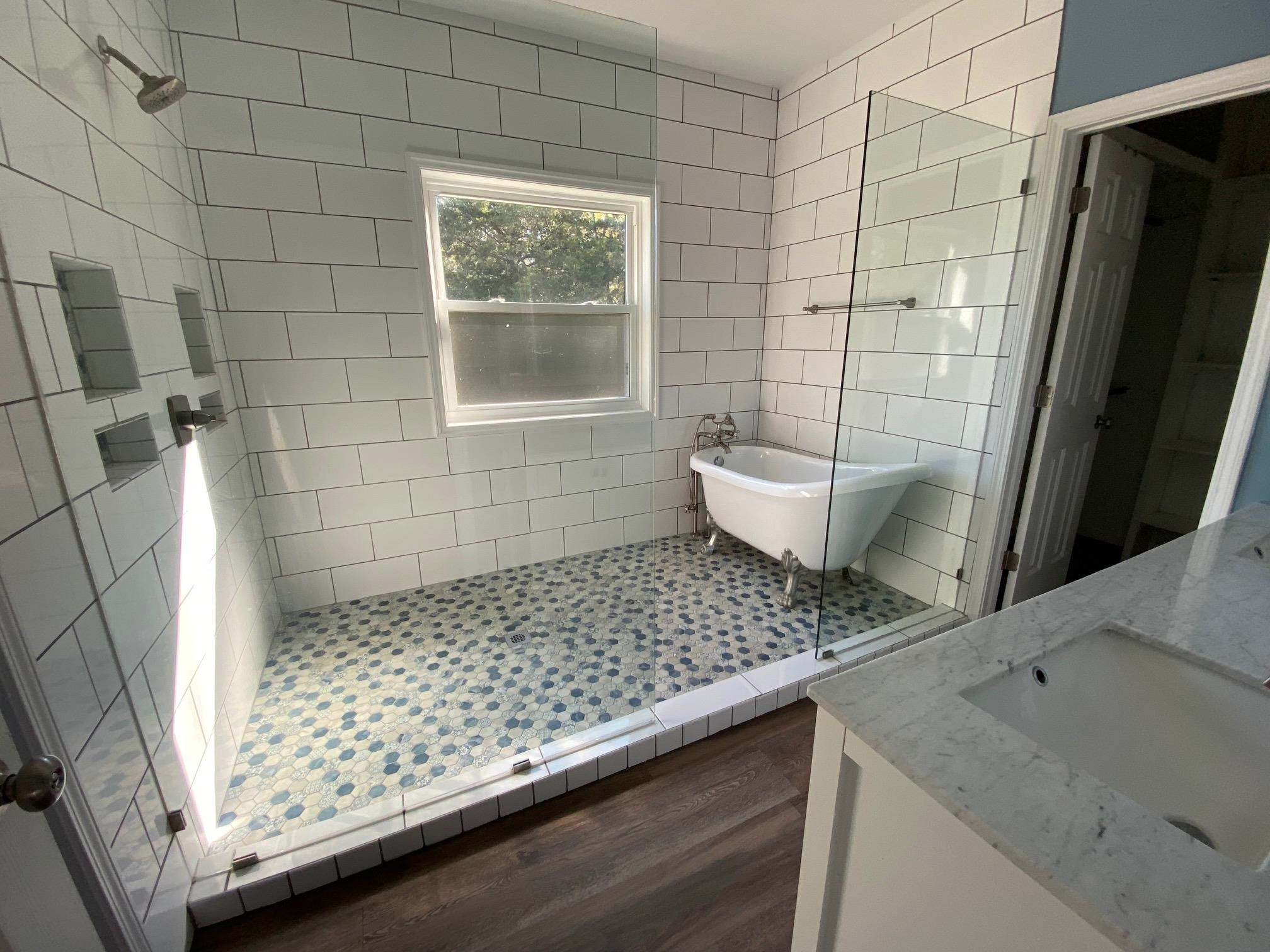 3650 Talley Store Road Henderson, TN 38340 - Photo 29 of 42 a bathroom with a sink a toilet a window and shower