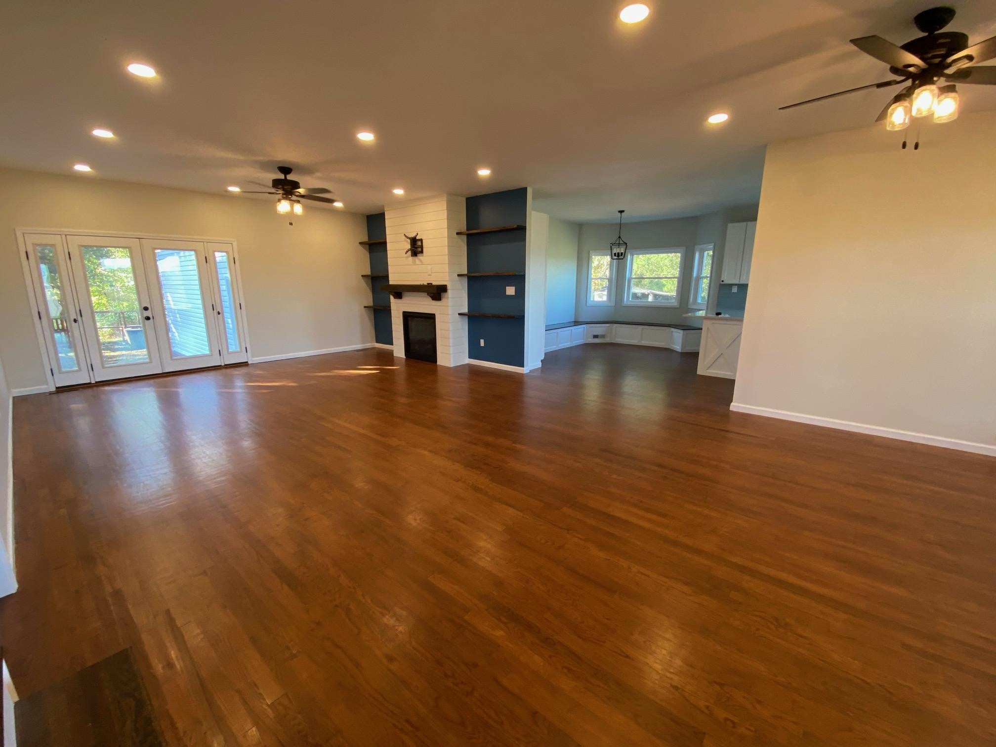 3650 Talley Store Road Henderson, TN 38340 - Photo 3 of 42 an empty room with wooden floor and windows