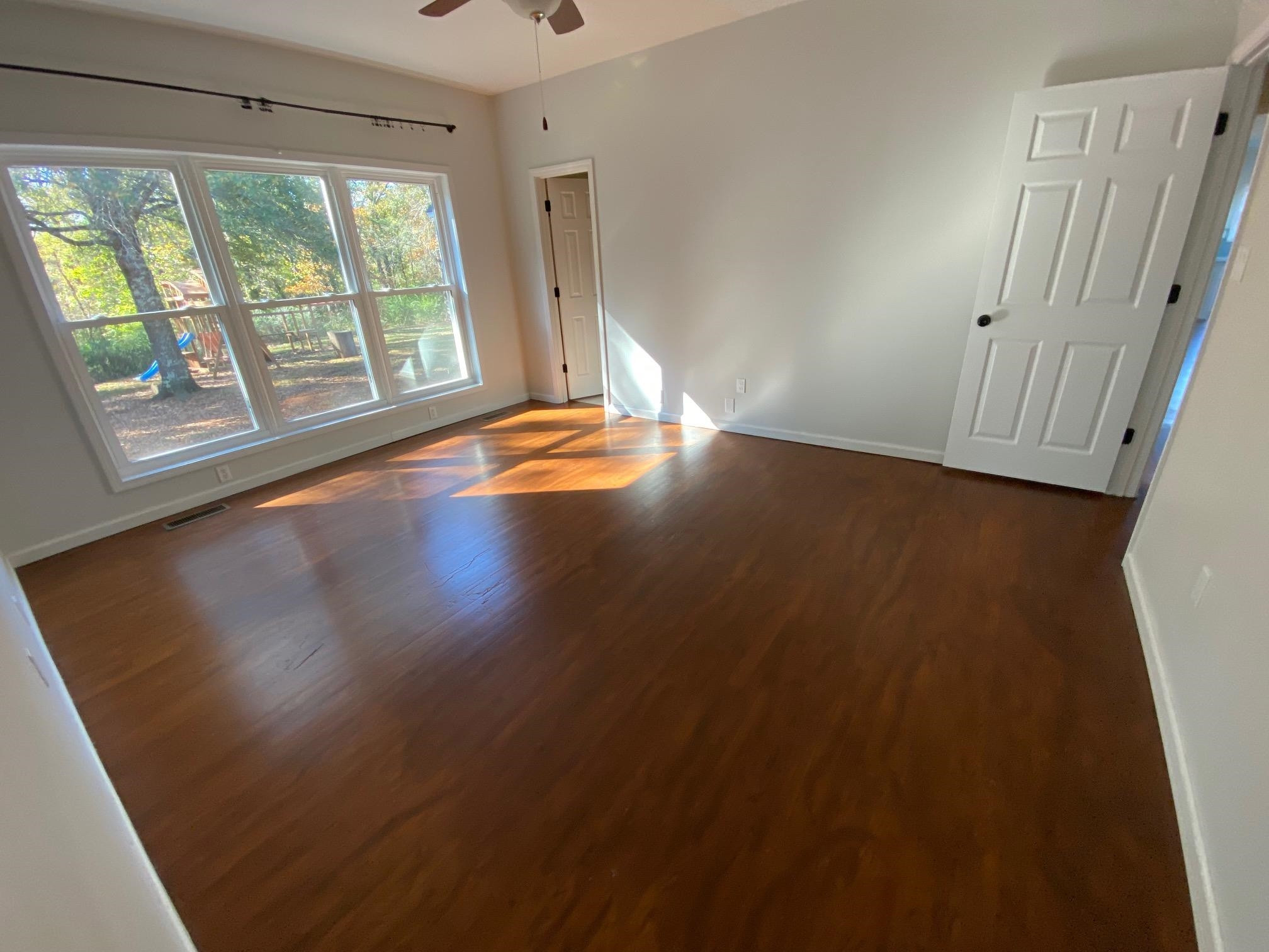 3650 Talley Store Road Henderson, TN 38340 - Photo 31 of 42 wooden floor in an empty room with a window