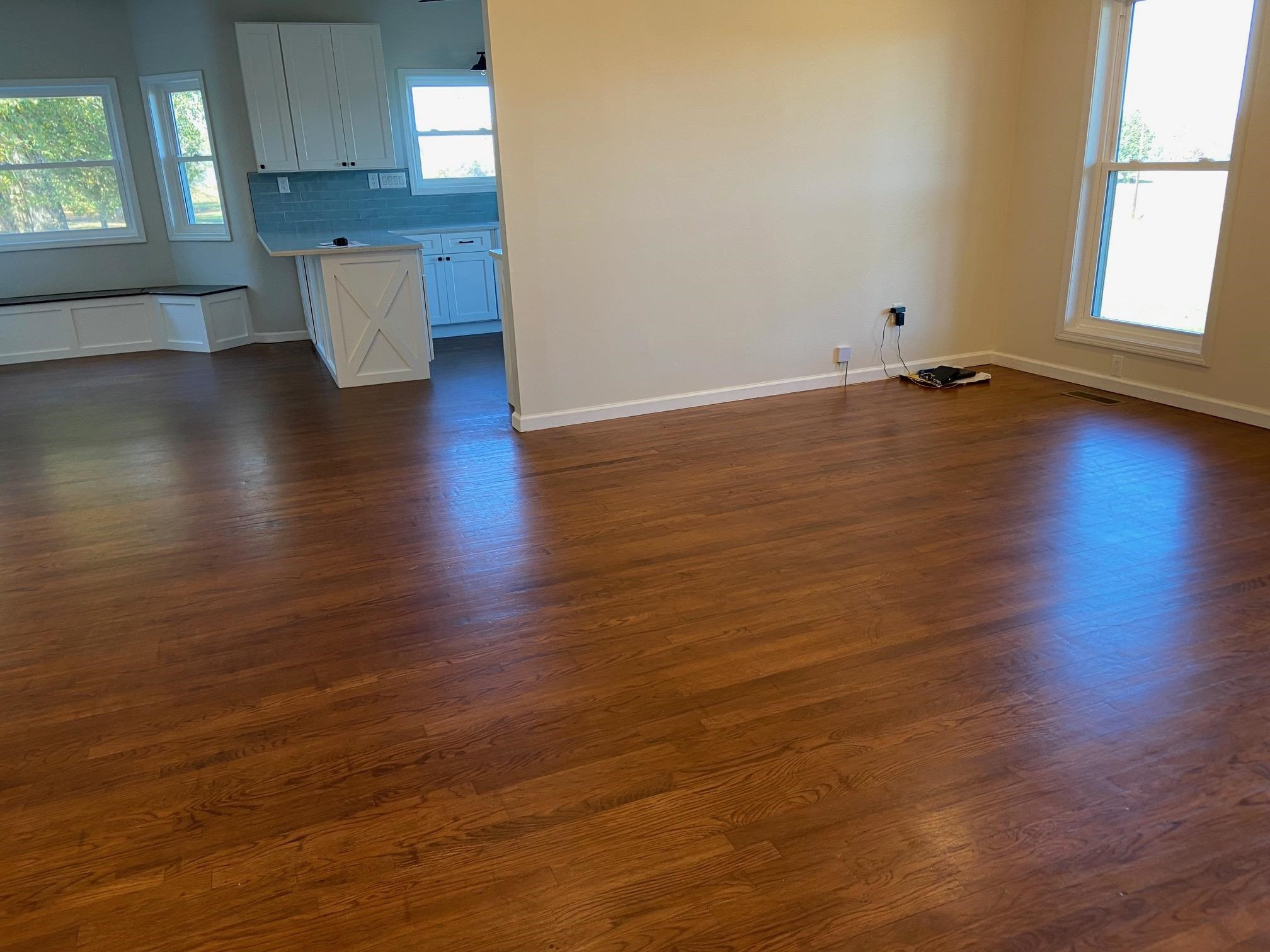 3650 Talley Store Road Henderson, TN 38340 - Photo 6 of 42 an empty room with wooden floor and windows