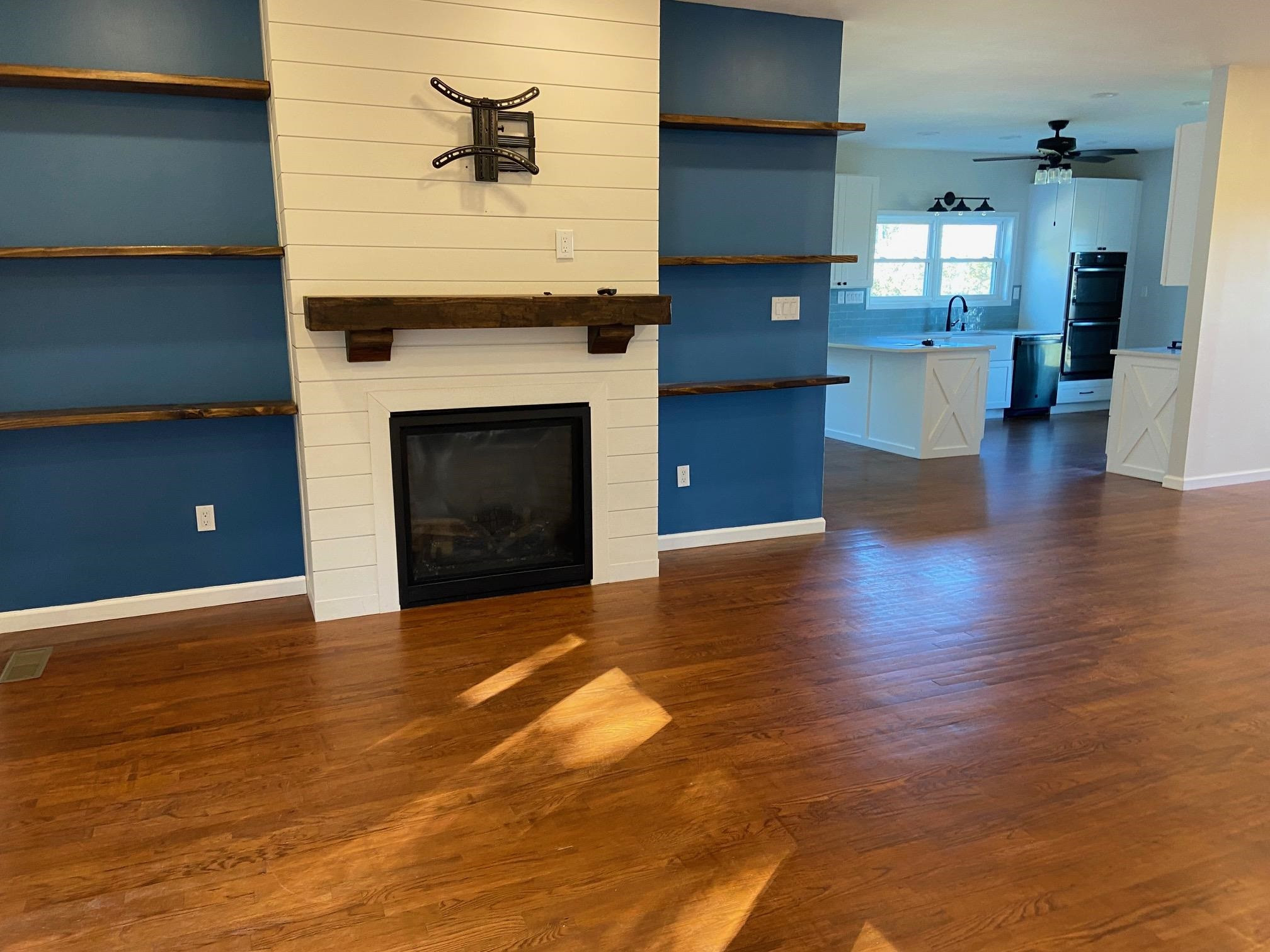 3650 Talley Store Road Henderson, TN 38340 - Photo 8 of 42 a living room with furniture and a fireplace
