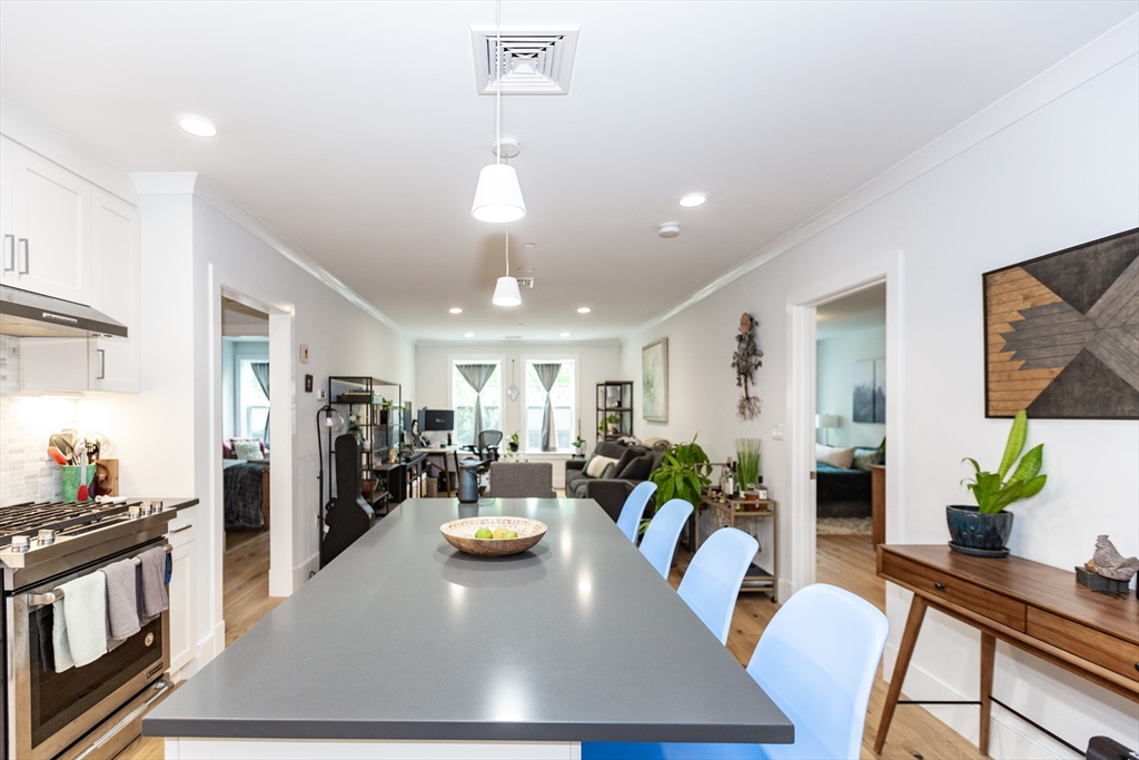 30 Polk Street, Unit 103 Boston, MA 02129 - Photo 4 of 20 a view of a dining room with furniture