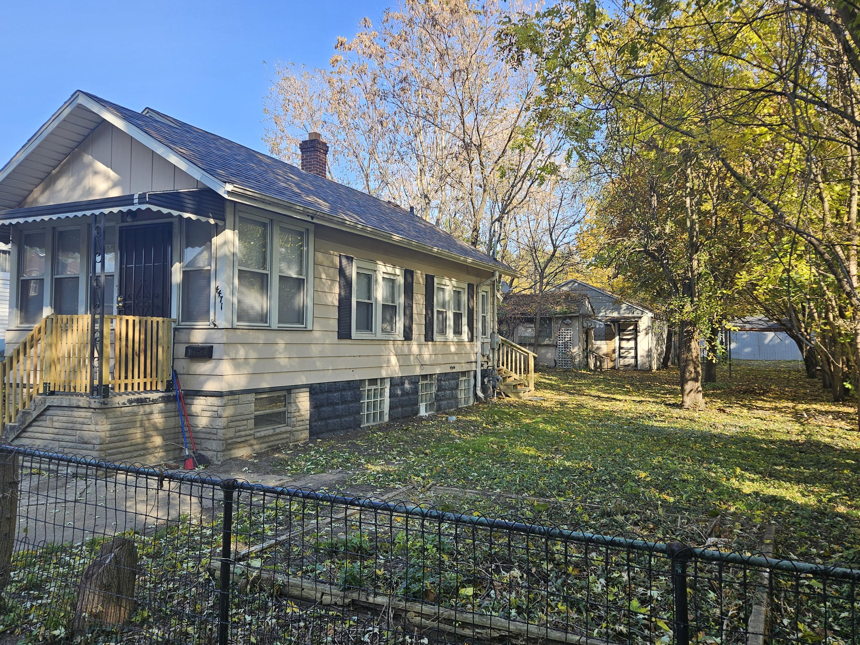 4471 Massachusetts Street Gary, IN 46409 - Photo 2 of 20 a front view of a house with a yard