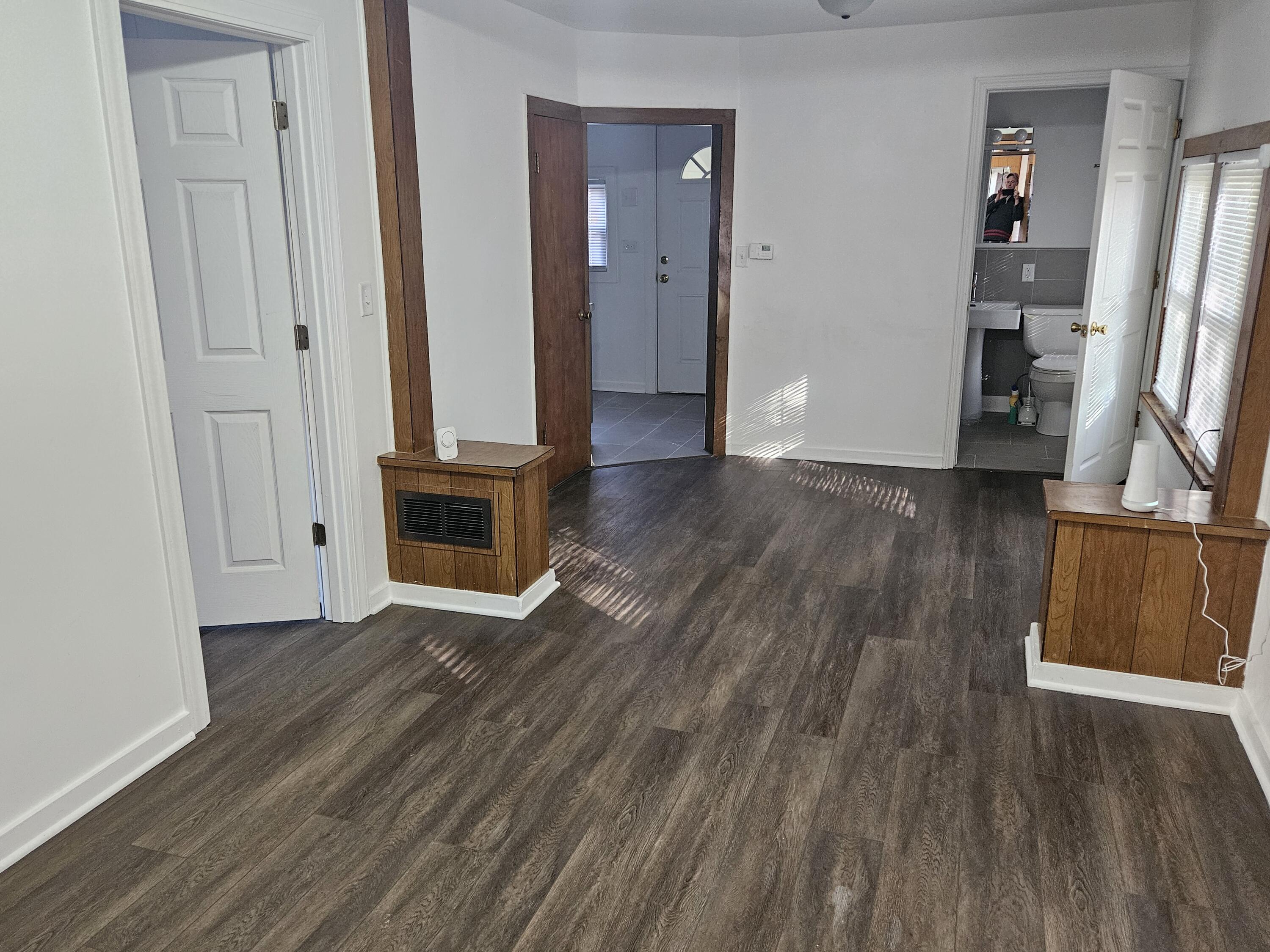 4471 Massachusetts Street Gary, IN 46409 - Photo 3 of 20 an empty room with wooden floor and closet