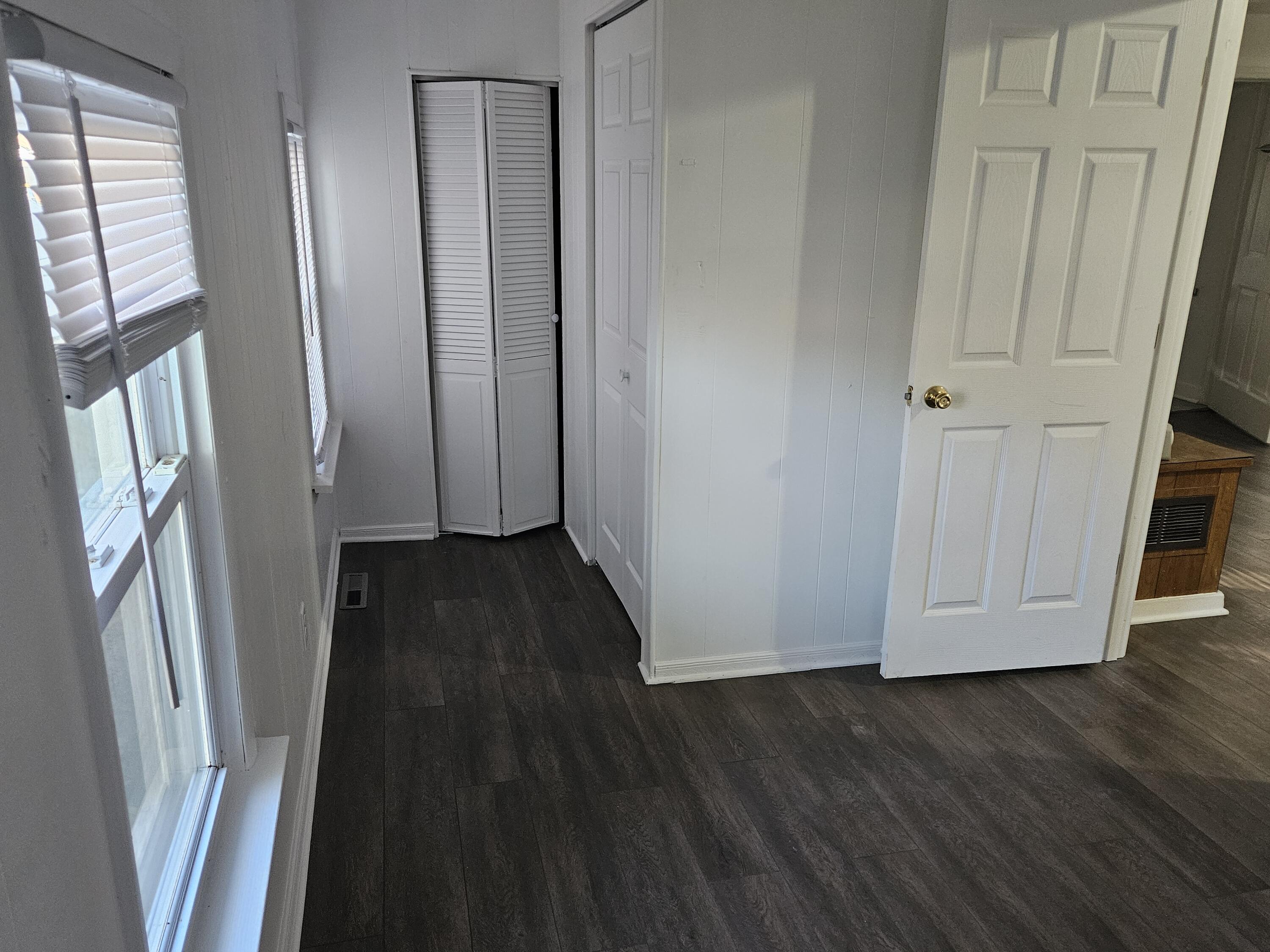 4471 Massachusetts Street Gary, IN 46409 - Photo 9 of 20 a view of a hallway with wooden floor and staircase