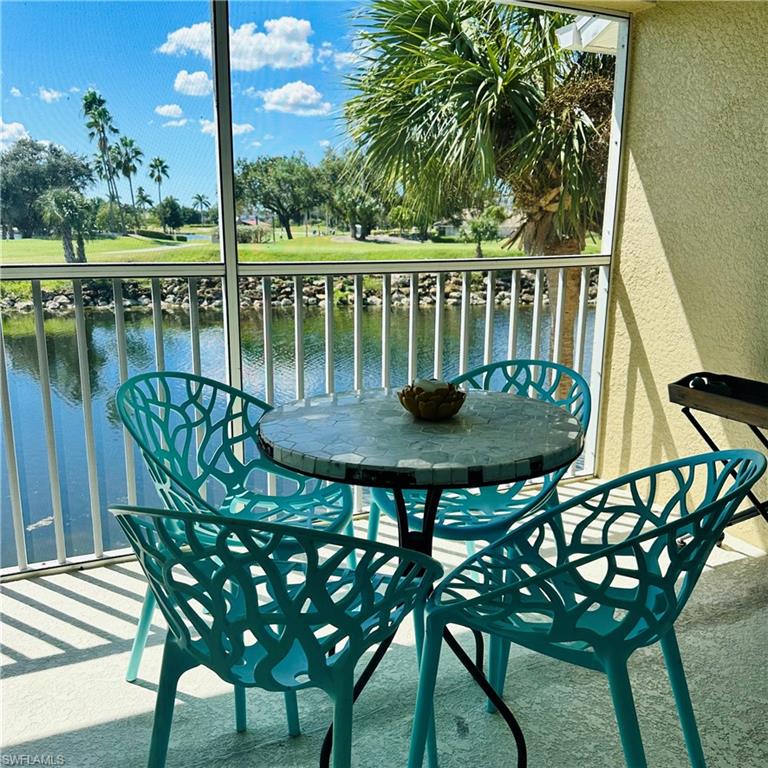 21300 Lancaster Run, Unit 926 Estero, FL 33928 - Photo 14 of 24 a view of a chairs and table in patio