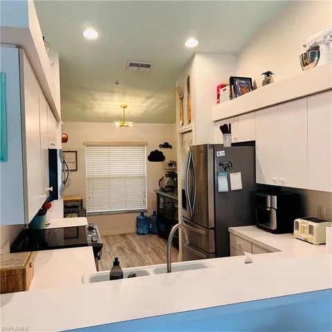 a bathroom with double vanity sink and a mirror