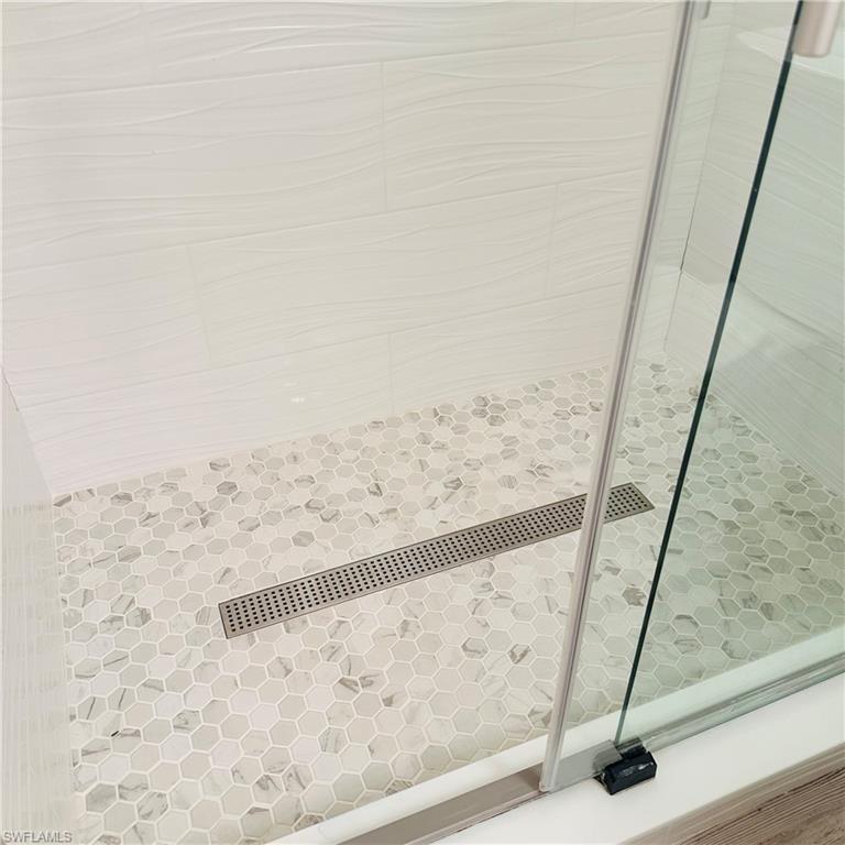 21300 Lancaster Run, Unit 926 Estero, FL 33928 - Photo 10 of 24 a view of wooden floor in a bathroom