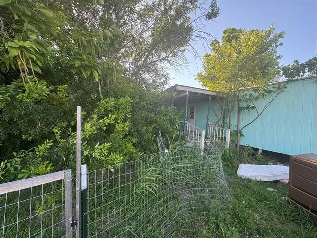 a backyard of a house with lots of green space