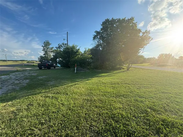 a view of a big yard with a house