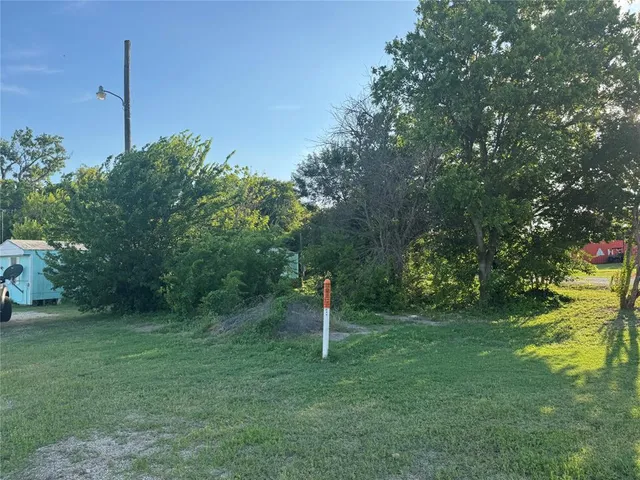 a fire hydrant in the middle of a field