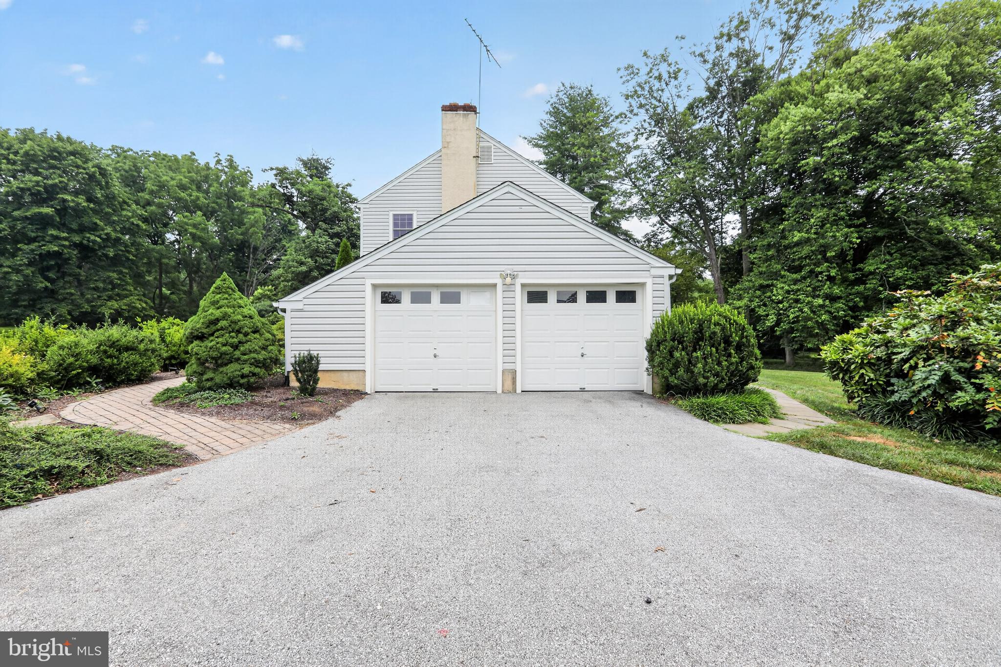 1408 Ponds Edge Road West Chester, PA 19382 - Photo 4 of 53 a view of a house with a yard and garage