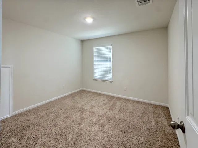 a bathroom with a sink a toilet a mirror and shower