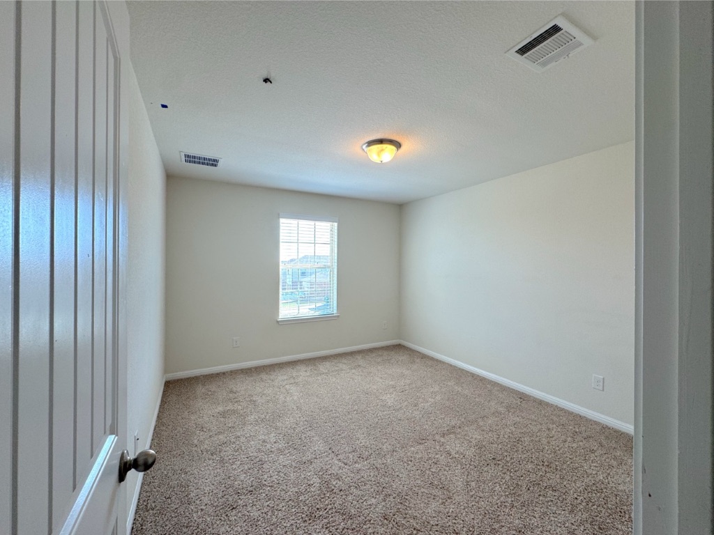 2056 Hat Bender Loop Round Rock, TX 78664 - Photo 24 of 27 a view of an empty room with a window