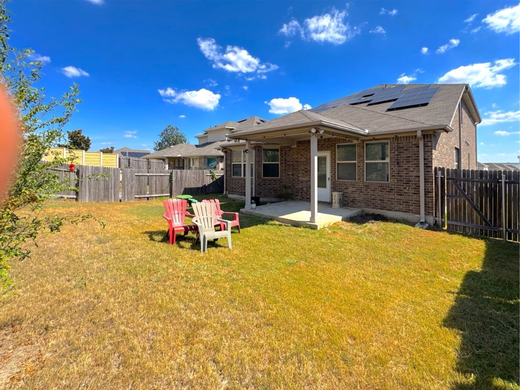 2056 Hat Bender Loop Round Rock, TX 78664 - Photo 27 of 27 a view of a patio with a table and chairs and potted plants