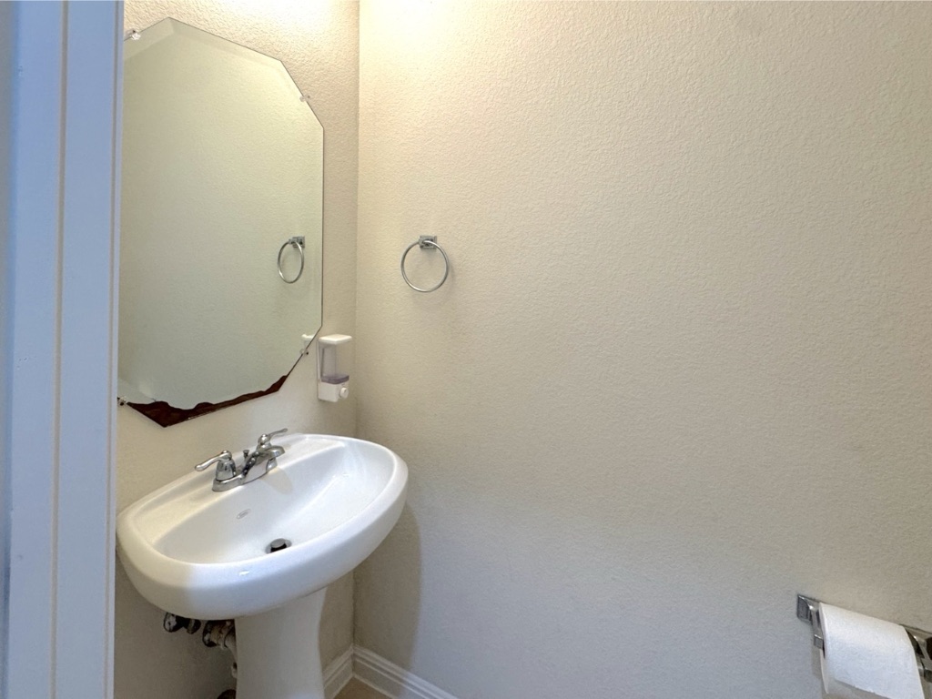 2056 Hat Bender Loop Round Rock, TX 78664 - Photo 5 of 27 a bathroom with a sink a mirror and a toilet