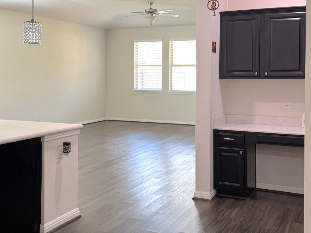 2056 Hat Bender Loop Round Rock, TX 78664 - Photo 7 of 27 a view of an empty room with wooden floor and a window