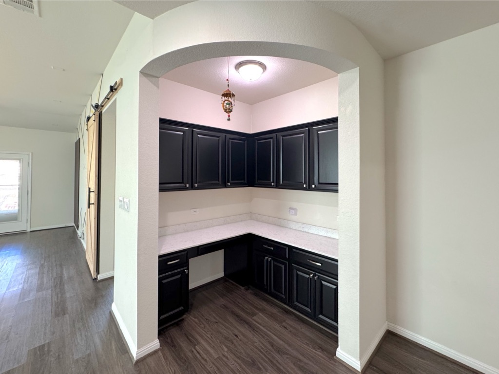 2056 Hat Bender Loop Round Rock, TX 78664 - Photo 8 of 27 a kitchen with stainless steel appliances granite countertop a stove and cabinets