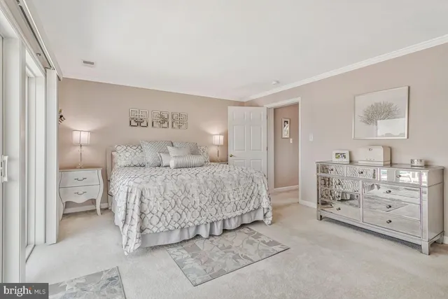 a bedroom with a bed and a cabinets