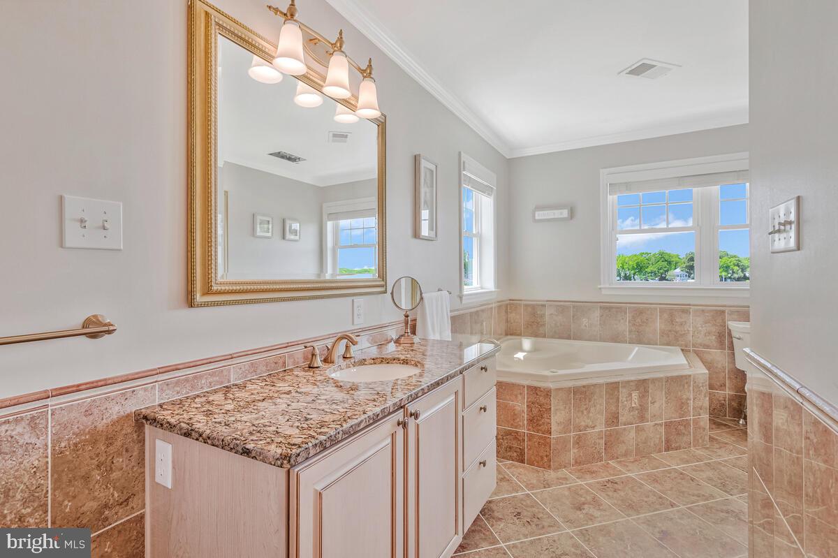 3300 Shore Drive Annapolis, MD 21403 - Photo 23 of 50 a bathroom with a sink and a mirror