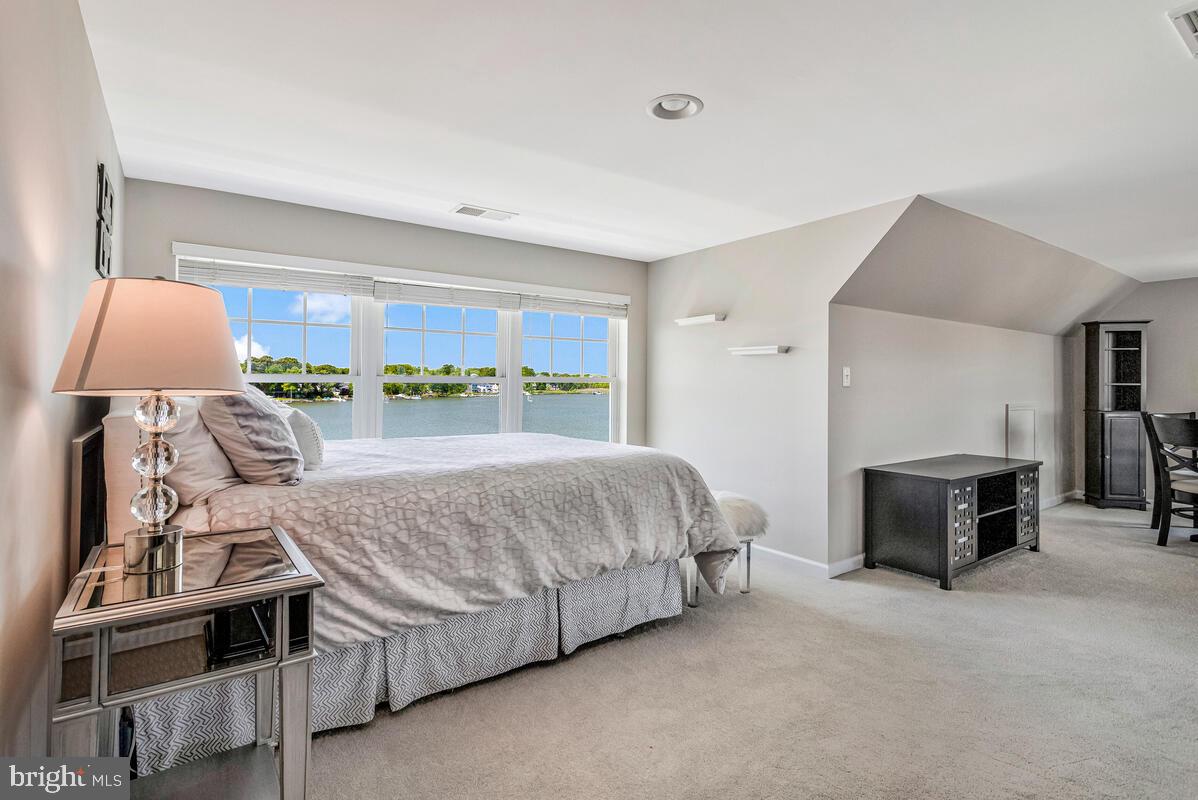 3300 Shore Drive Annapolis, MD 21403 - Photo 31 of 50 a spacious bedroom with a bed and a dresser in it
