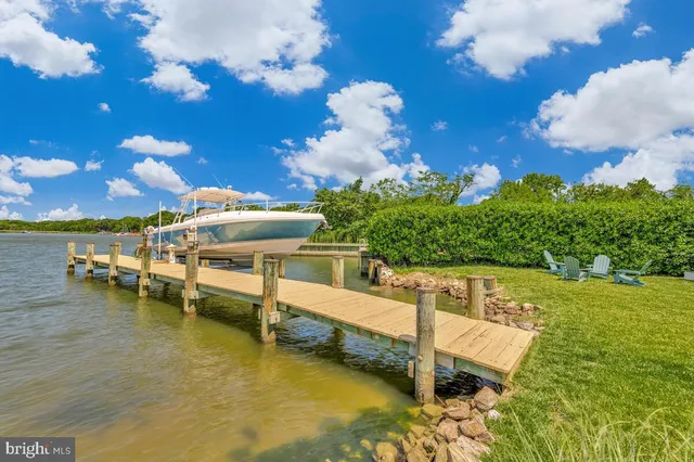 a view of a swimming pool with an outdoor seating