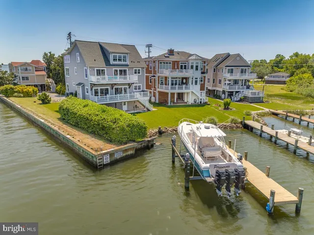 a aerial view of a house with swimming pool in front of it
